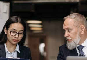two corporate employees discussing