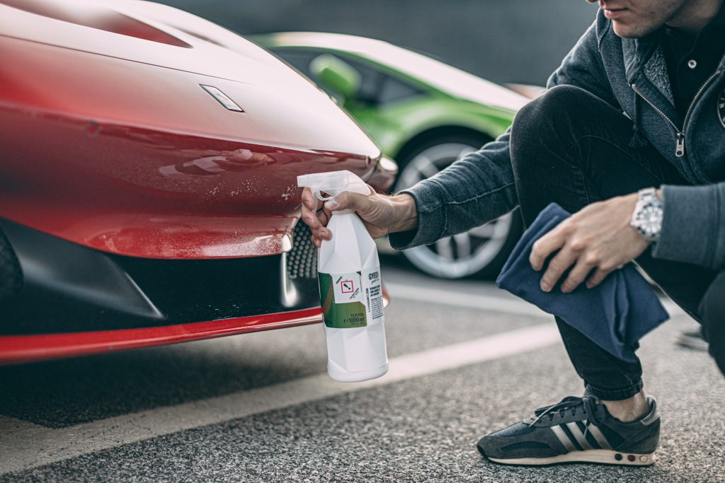 a man spraying paint protection